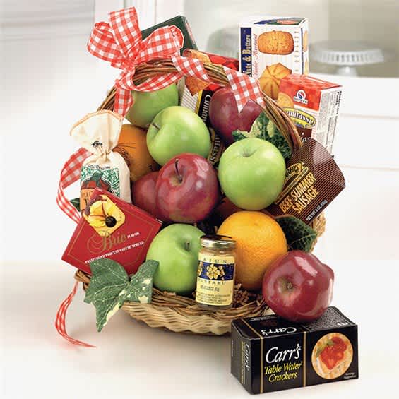 Basket of fruit and packaged snacks tied with a red gingham ribbon