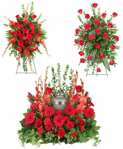 Red floral funeral tribute with a silver urn centerpiece and standing sprays