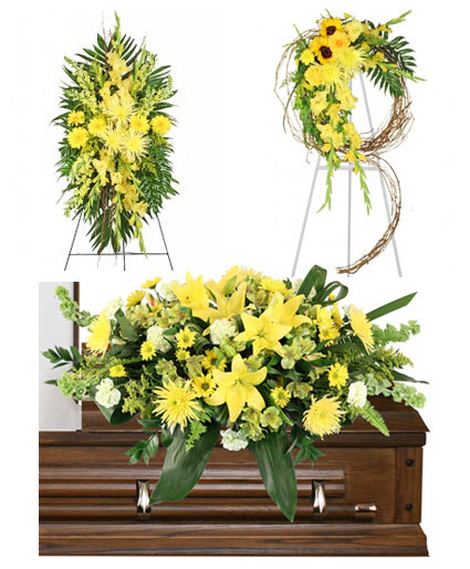 Yellow floral funeral tribute on a casket with matching standing sprays