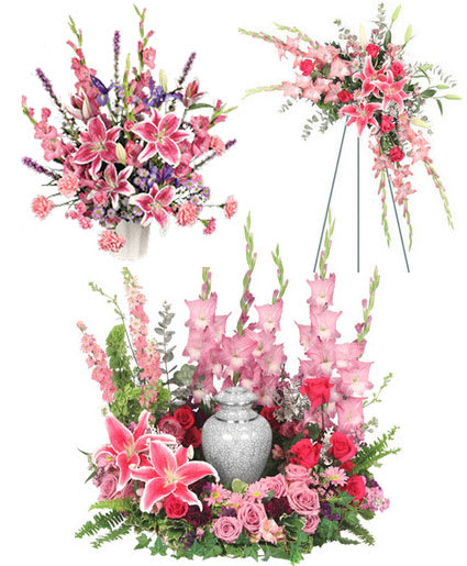 Pink lilies and roses arranged around a silver urn with matching standing sprays