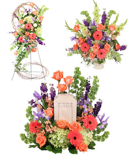 Floral arrangement with orange roses, pink gerbera daisies, and purple blooms
