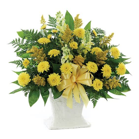 Yellow flower arrangement in a white vase with a yellow ribbon