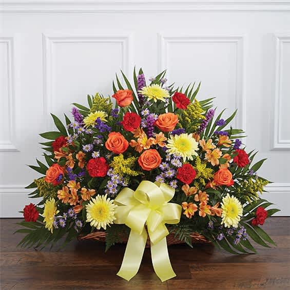 Mixed flower basket with a yellow ribbon bow