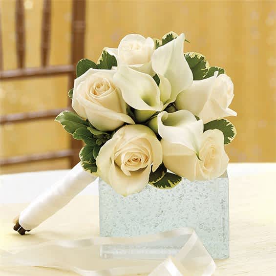 White rose and calla lily bridal bouquet with a satin ribbon handle