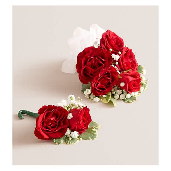 Red rose corsage and boutonniere with white baby's breath