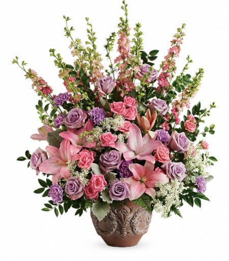 Pink and lavender floral arrangement in a decorative vase