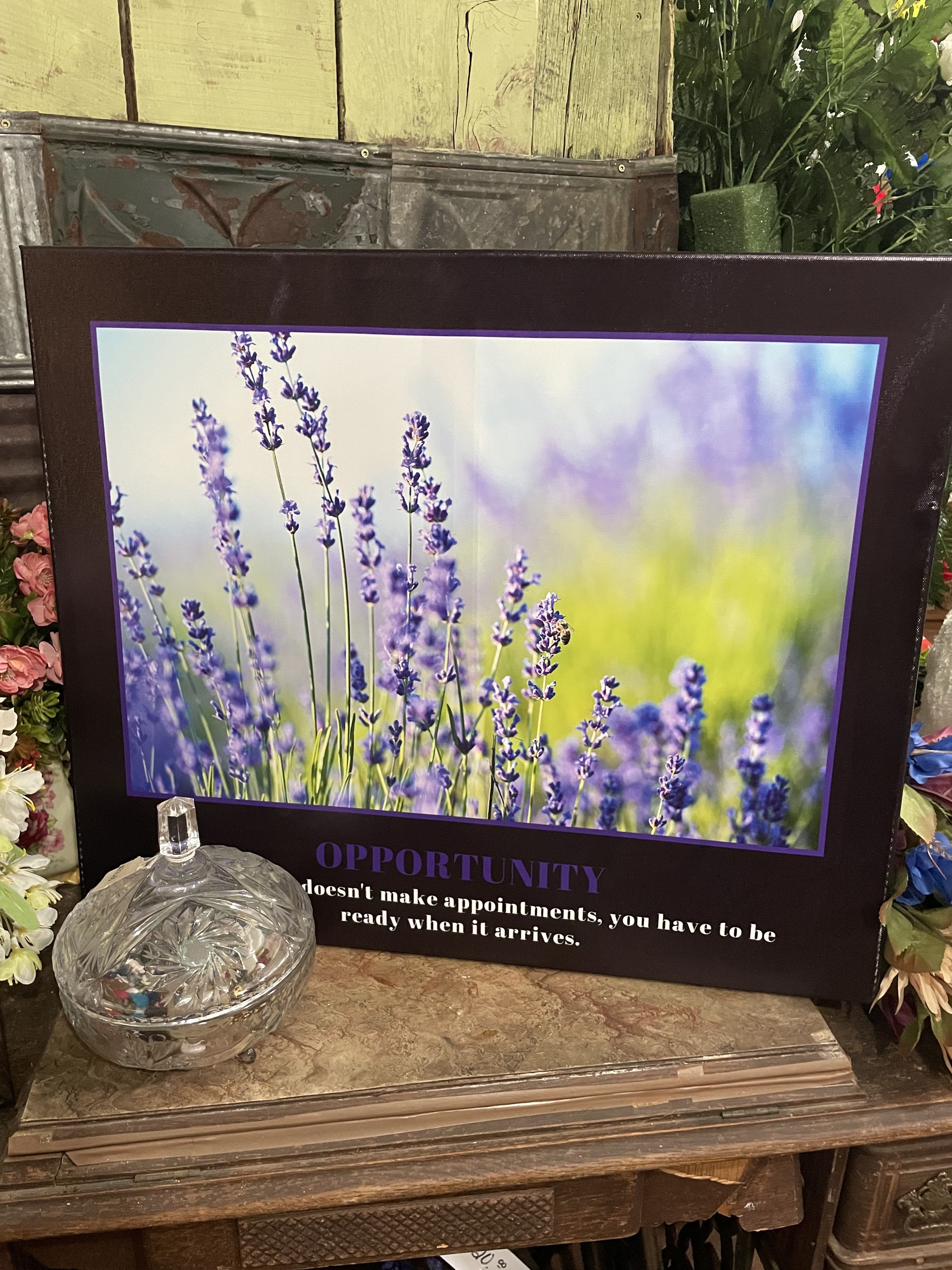 Framed lavender flower print with a glass dish in front
