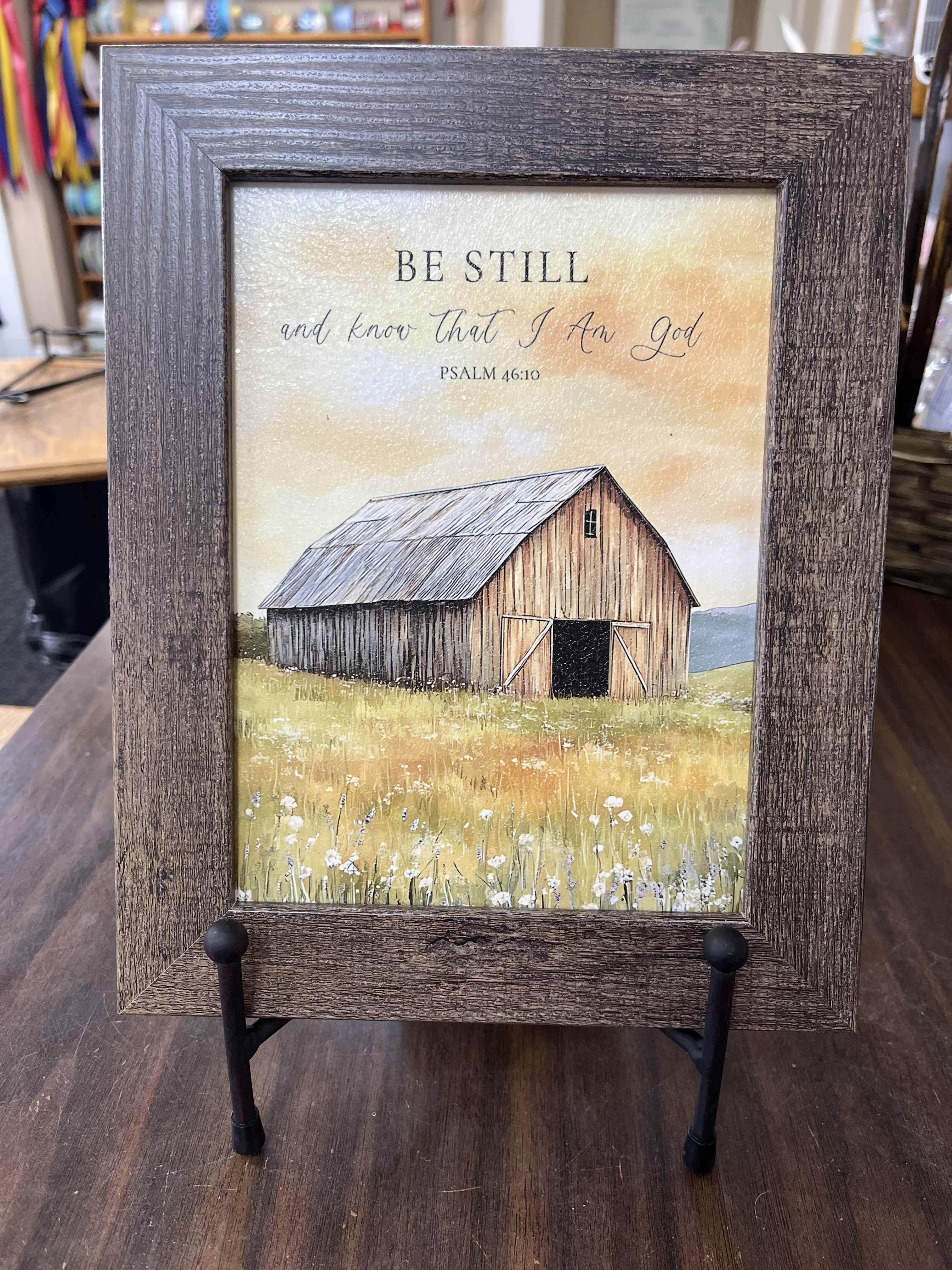 Framed barn print with the words "Be Still and know that I am God"
