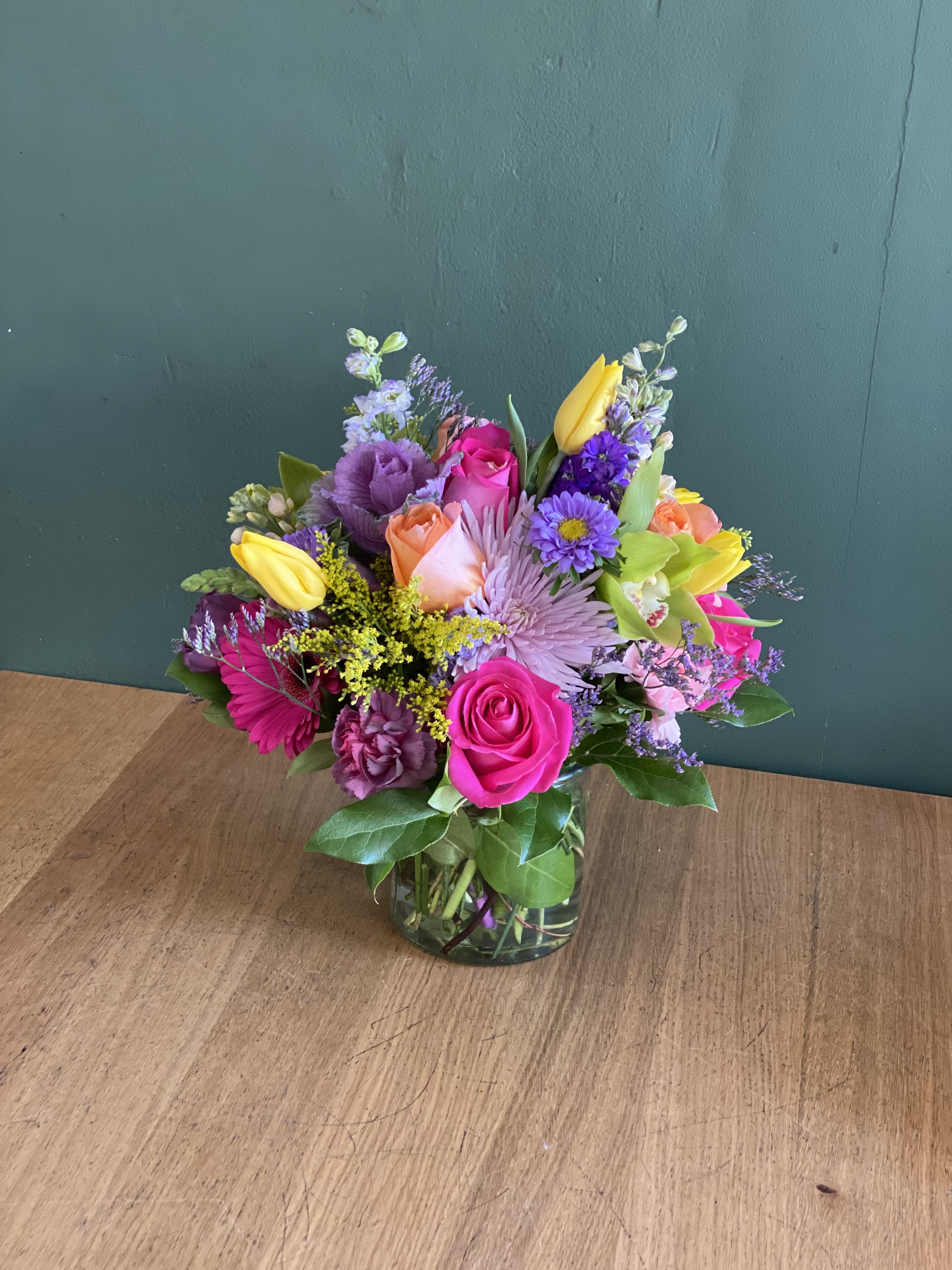 Colorful mixed bouquet in a glass vase