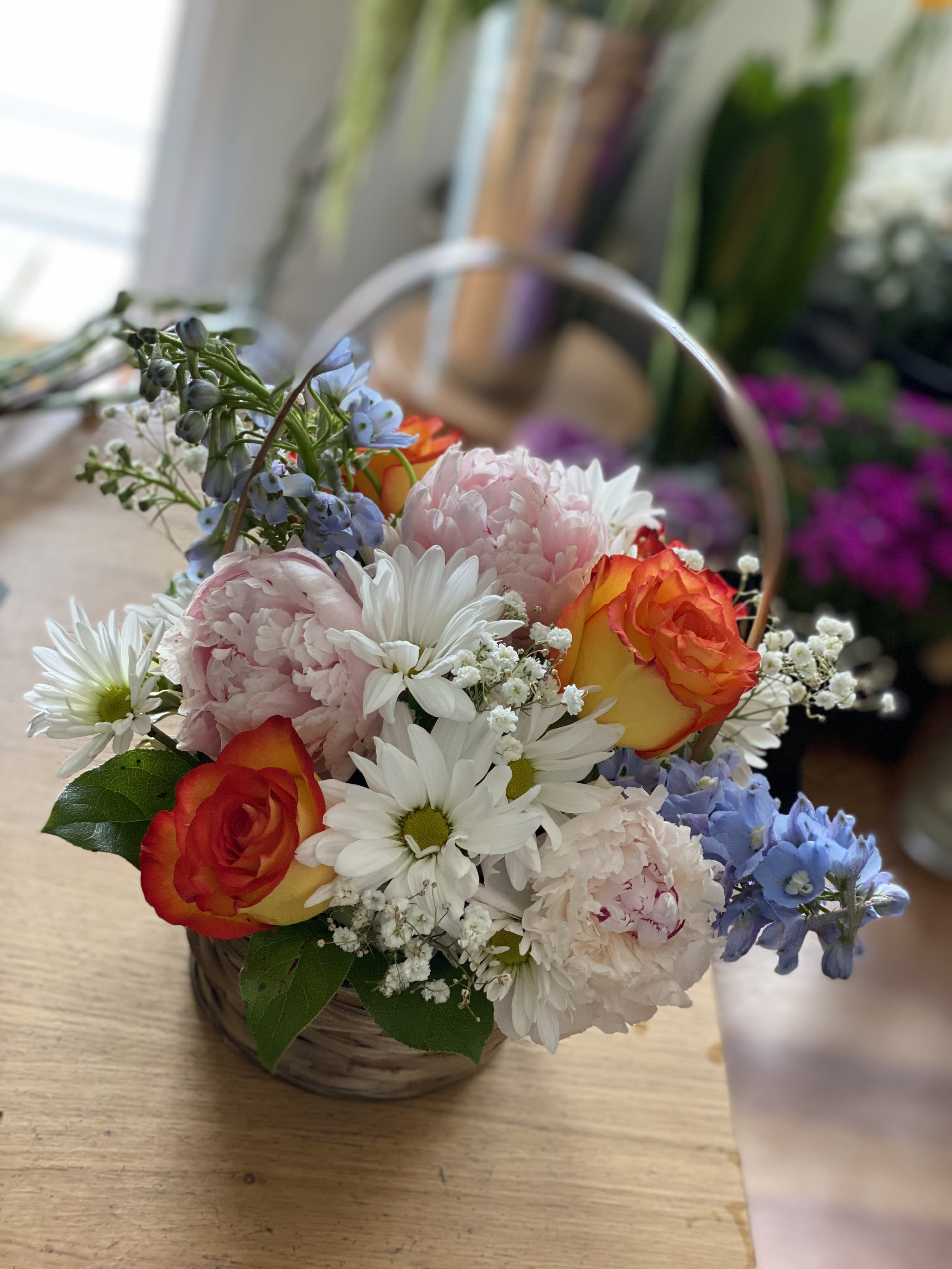Ella's Basket - Basket filled with daises, baby's breath, peonies, roses and delphiniums  (please note standard size basket only has 4 peonies)