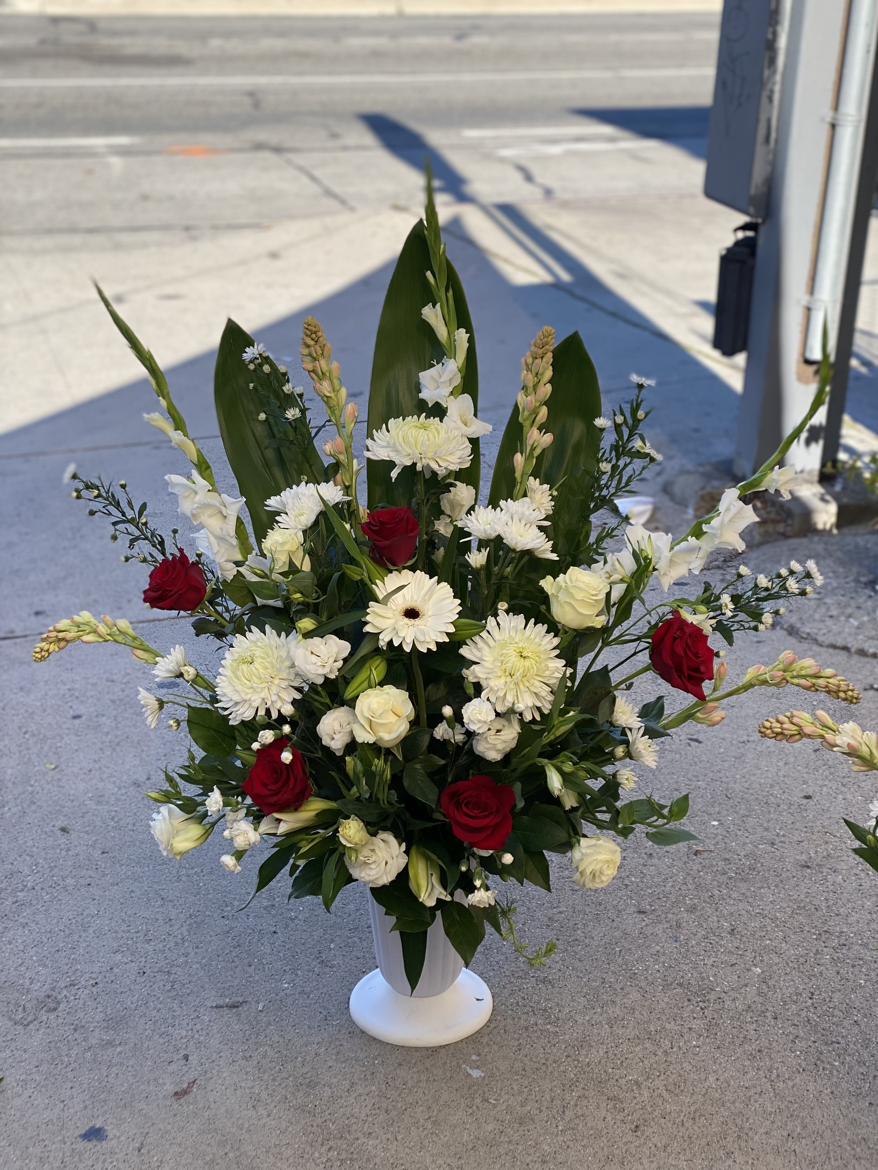 Forever  - Spray arrangement in a white vase, with red and white fresh blooms