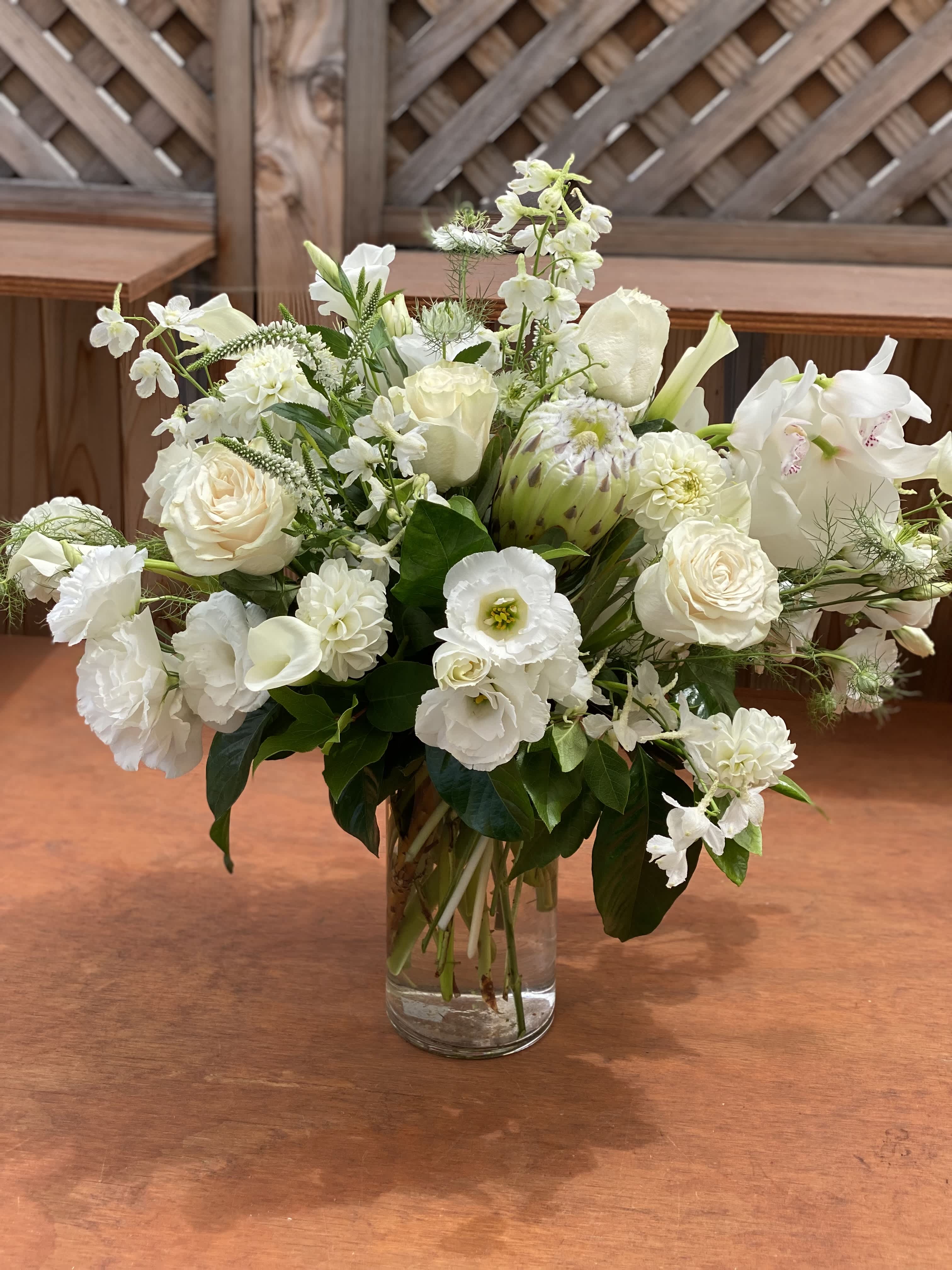 Proteus - Extravagant and clean floral arrangement filled with unique white blooms.  (Please note: some blooms are seasonal and may be substitute)  