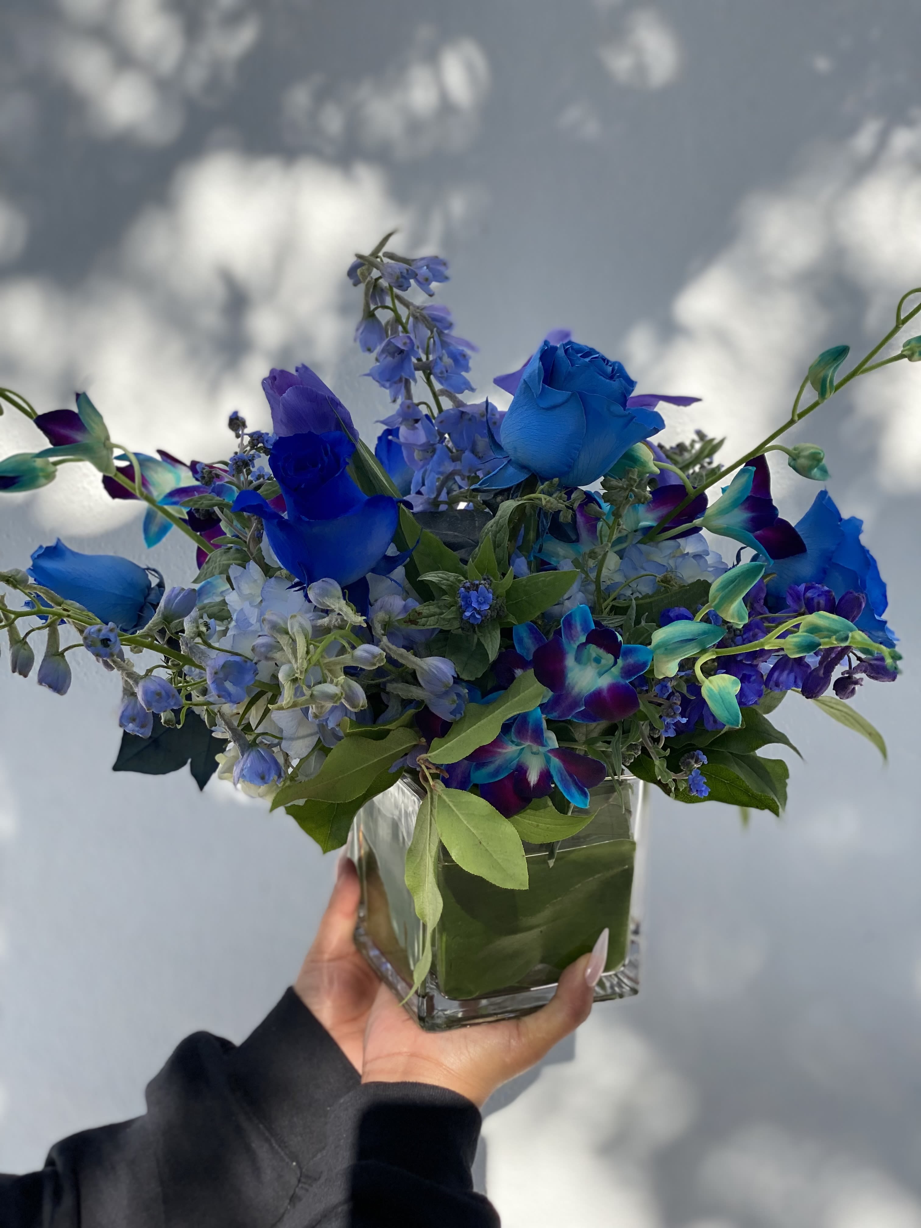 Mi Cielo  - Arrangement in glass vase with shades of blues, that include hydrengea, orchid, roses and much more 