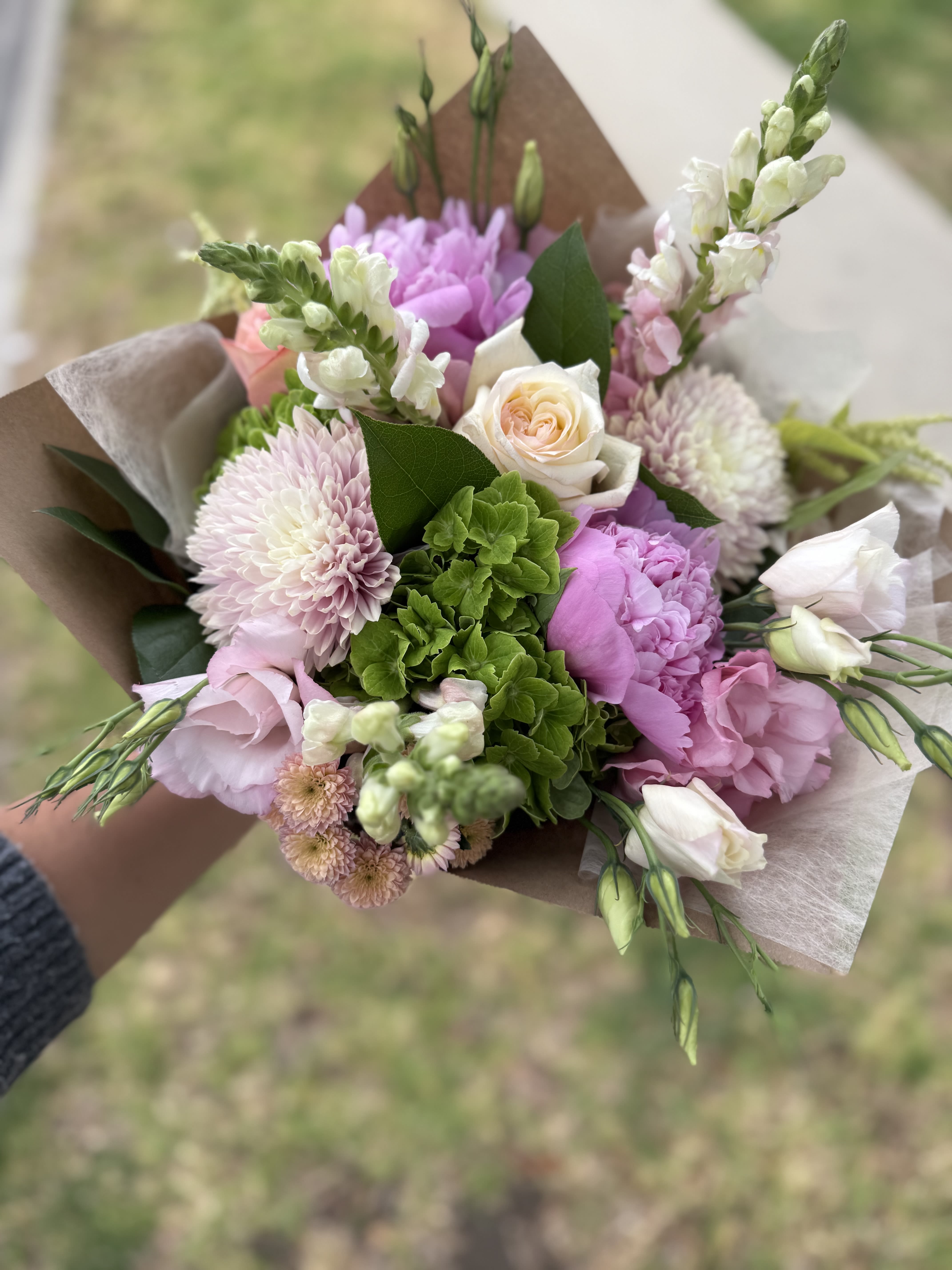 Verano  - In season summer blooms!  Hand wrapped Bouquet that includes hydrangeas, snap dragon roses and much more! 