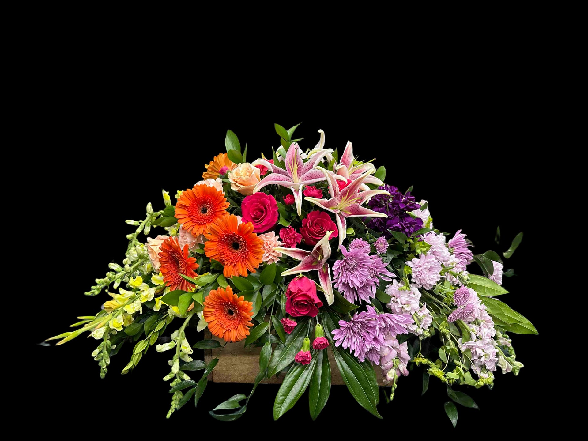 Colorful Memories Casket Spray - Colorful arrangement where flowers are organized by colors of the rainbow.