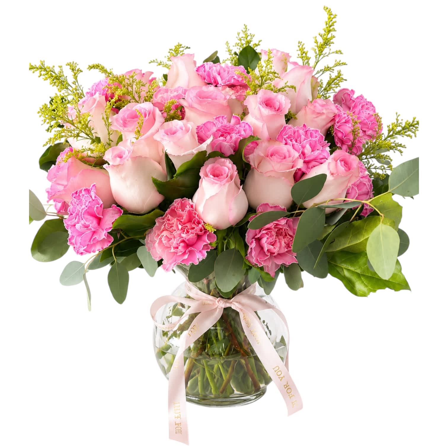 Pink roses and carnations in a glass vase with a ribbon