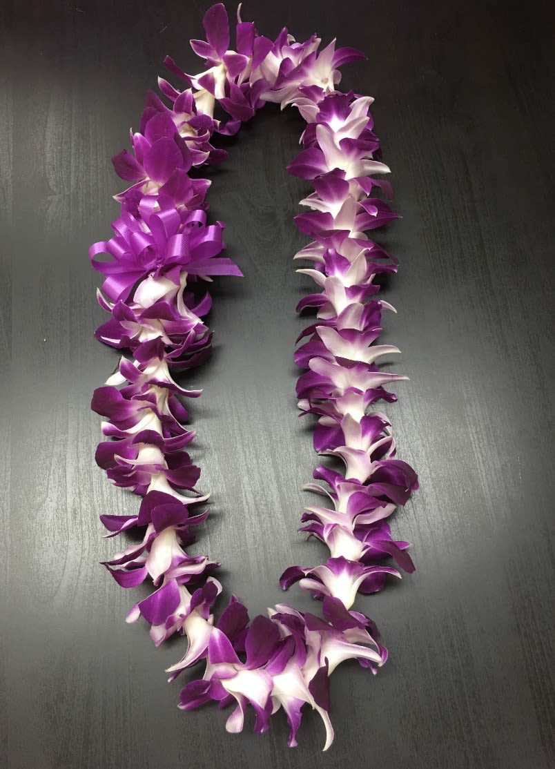 orchid Lei - The Timeless Dendrobium Orchid Lei Handcrafted with care, our signature single-strand orchid lei is a breathtaking symbol of Hawaiian hospitality. Featuring vibrant, velvety Dendrobium orchid blossoms, this lei is as durable as it is beautiful. Perfect for graduations, birthdays, or weddings, it carries a sense of celebration and "Aloha" that lasts throughout the day.  Best for: Special milestones, formal events, and traditional gifts.