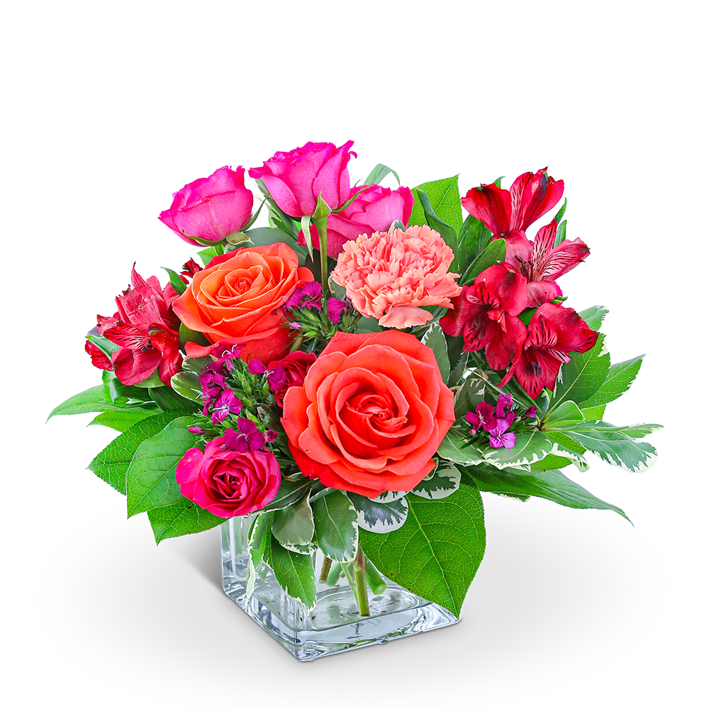 Pink and orange roses with red alstroemeria in a glass vase