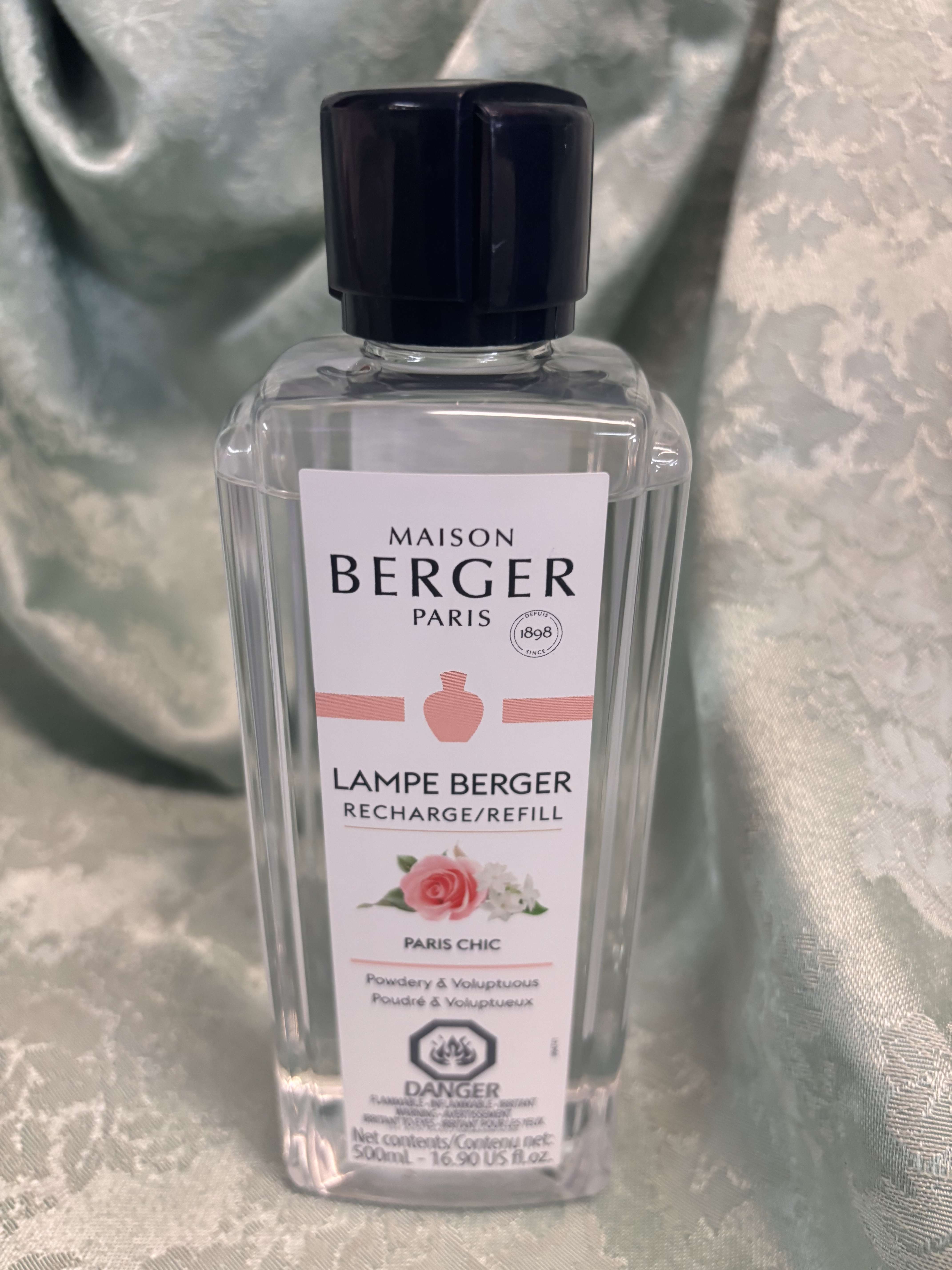 Clear bottle of Maison Berger Paris Lampe Berger refill with black cap