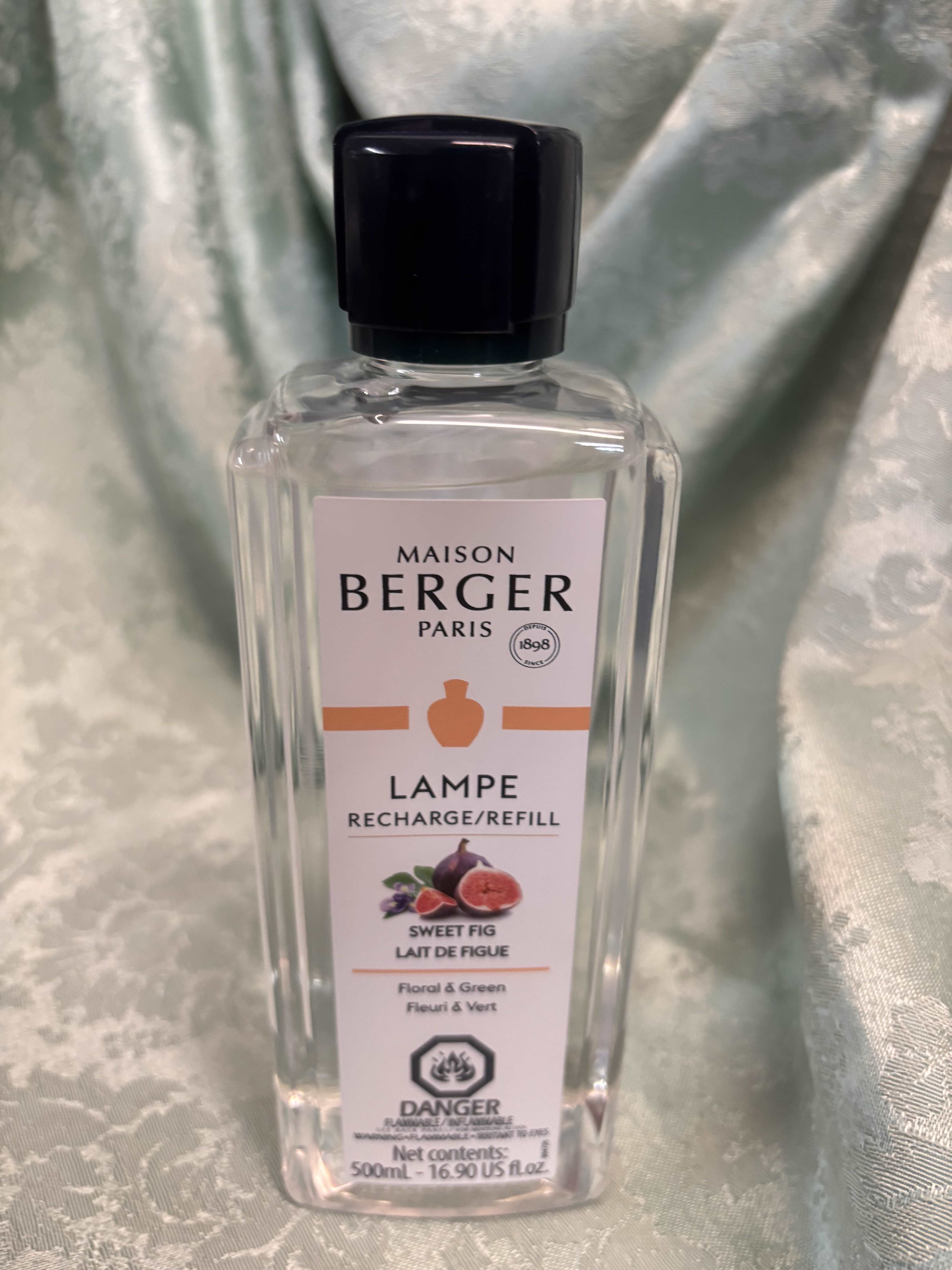 Bottle of Maison Berger Sweet Fig lamp refill with a black cap