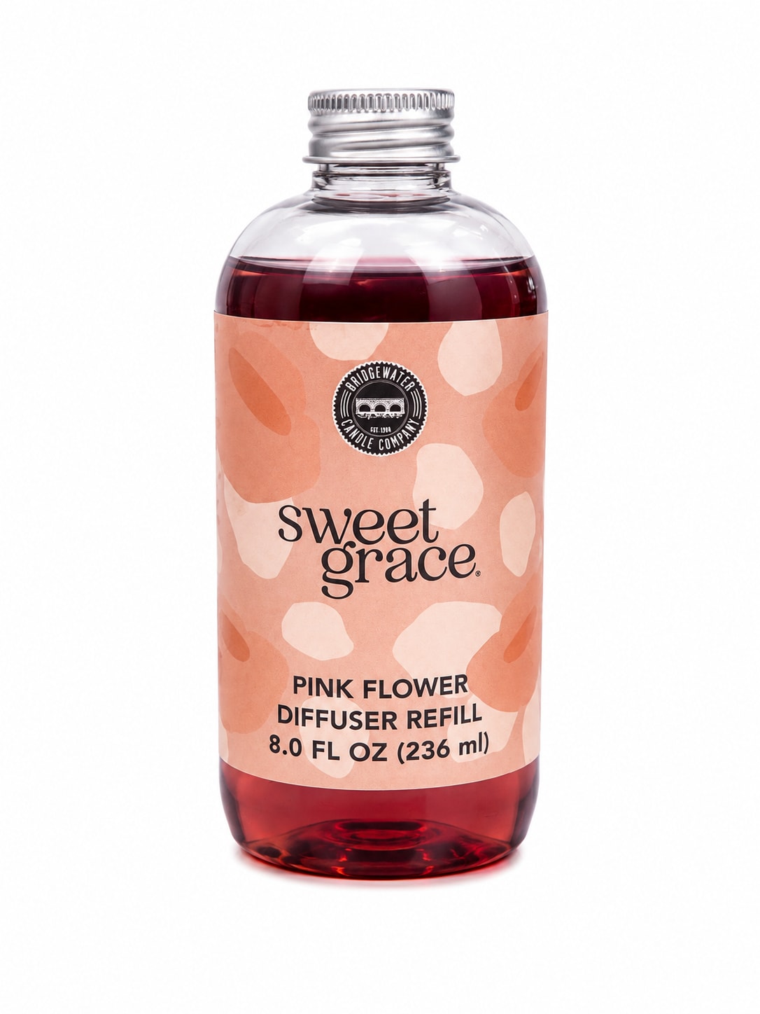 Bottle of pink flower diffuser refill with a peach label