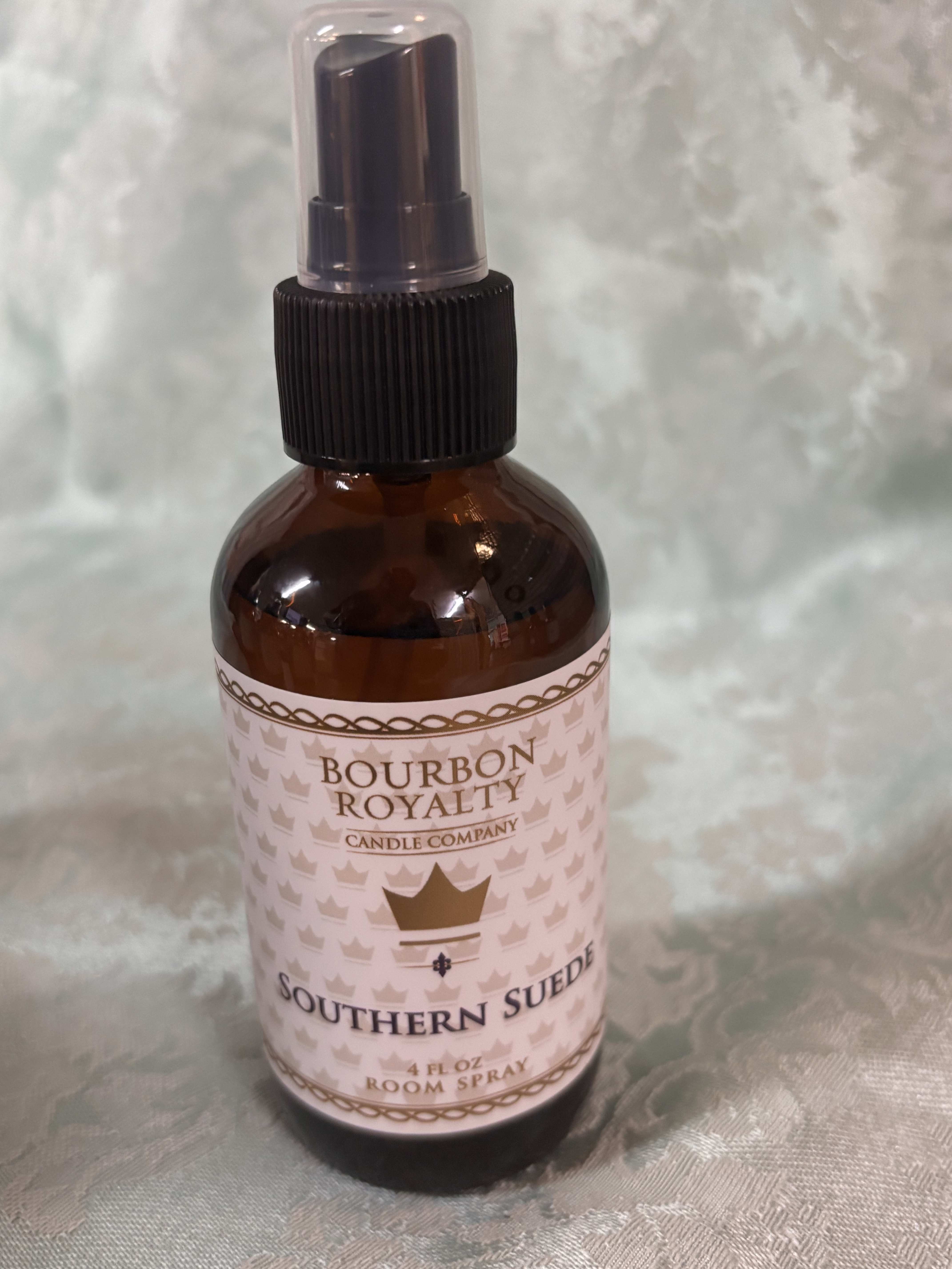 Amber room spray bottle labeled Southern Suede