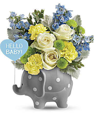 Blue and yellow flower arrangement in a gray elephant planter with a "Hello Baby!" balloon