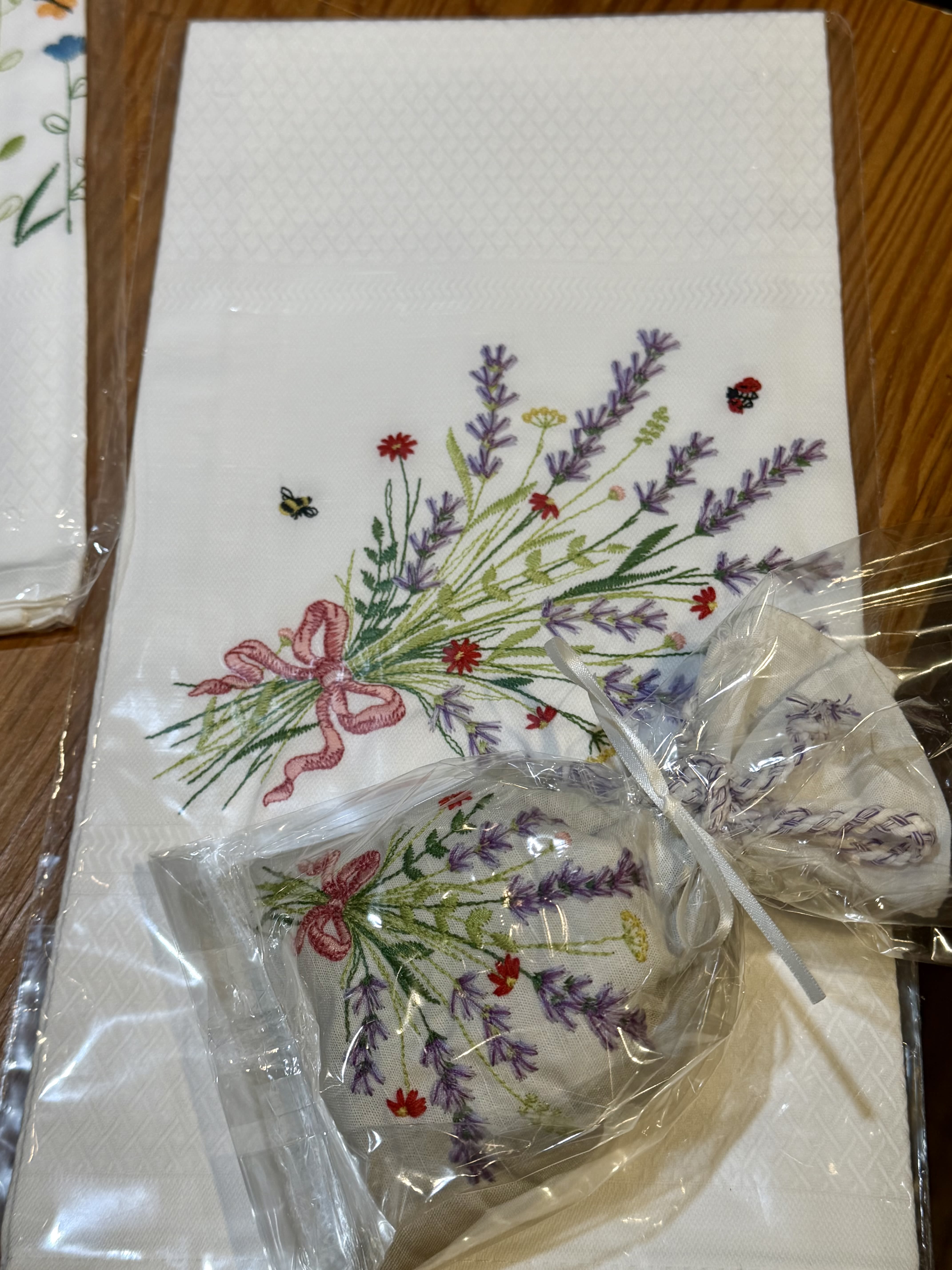 Embroidered floral napkins with lavender and pink ribbon bows