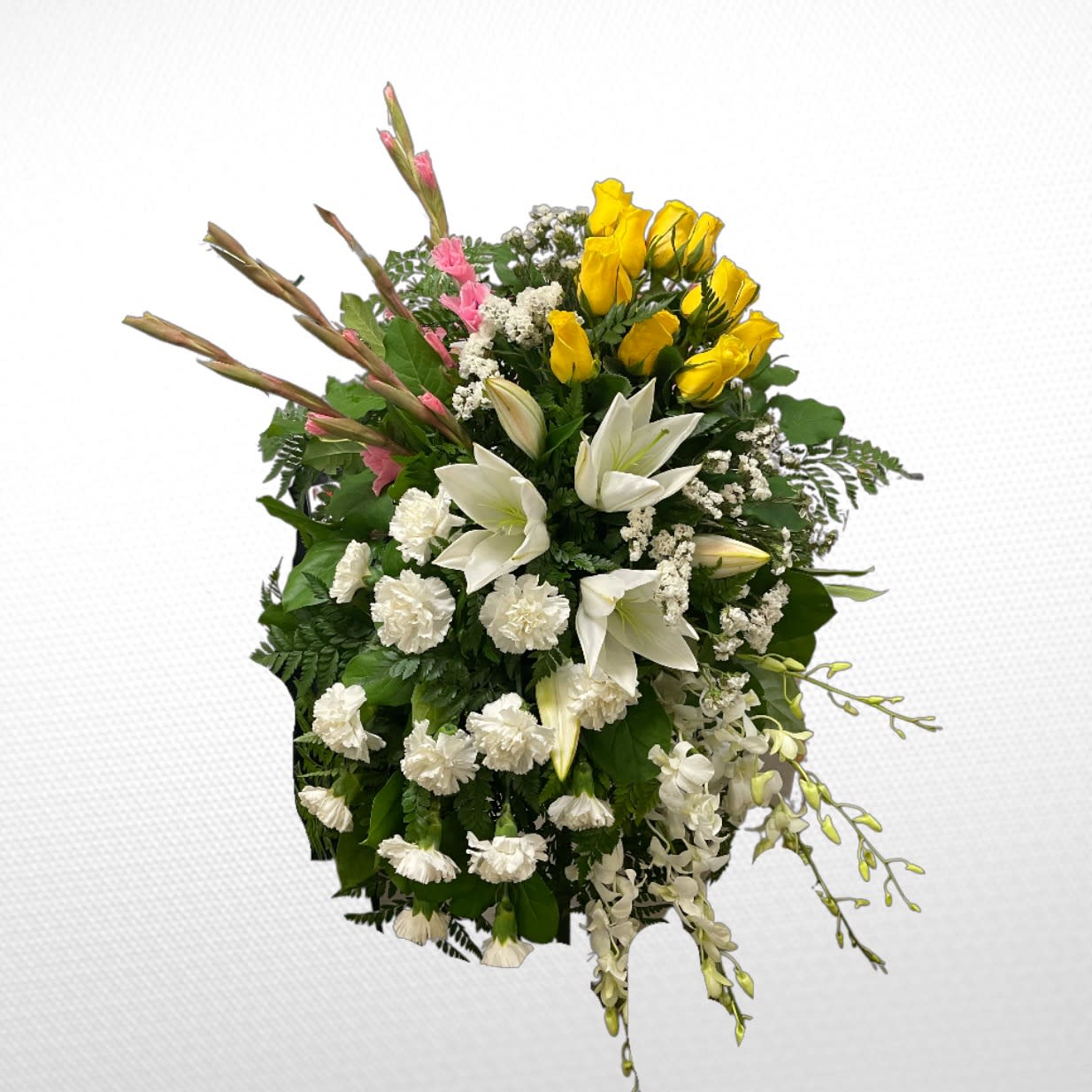 Standing floral spray with white lilies, yellow roses, and white orchids