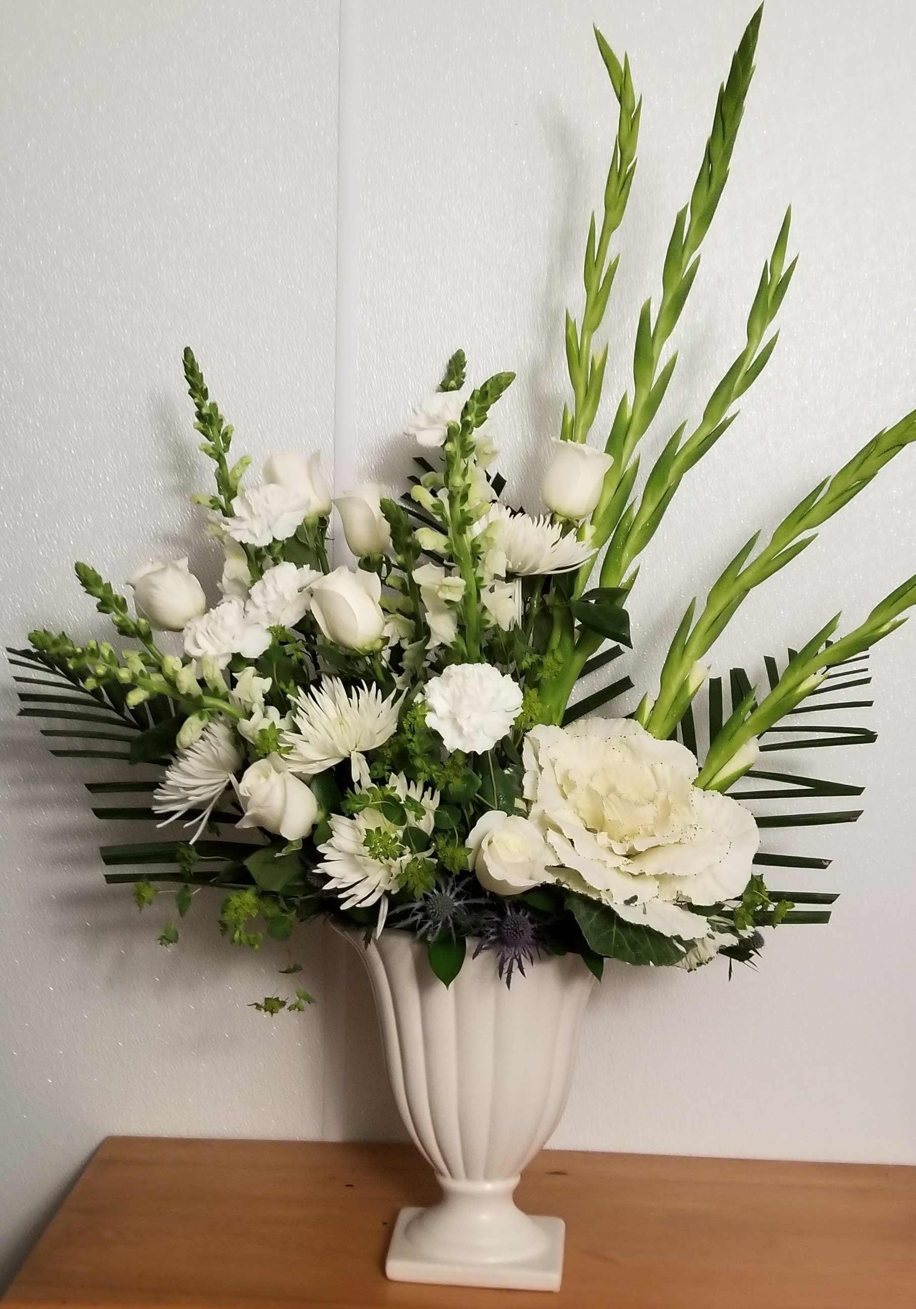 White and Wonderful - A large white arrangement is suitable for a memorial service to honor your loved ones. Please allow 72 hours for this arrangement. Thank you for your understanding. 