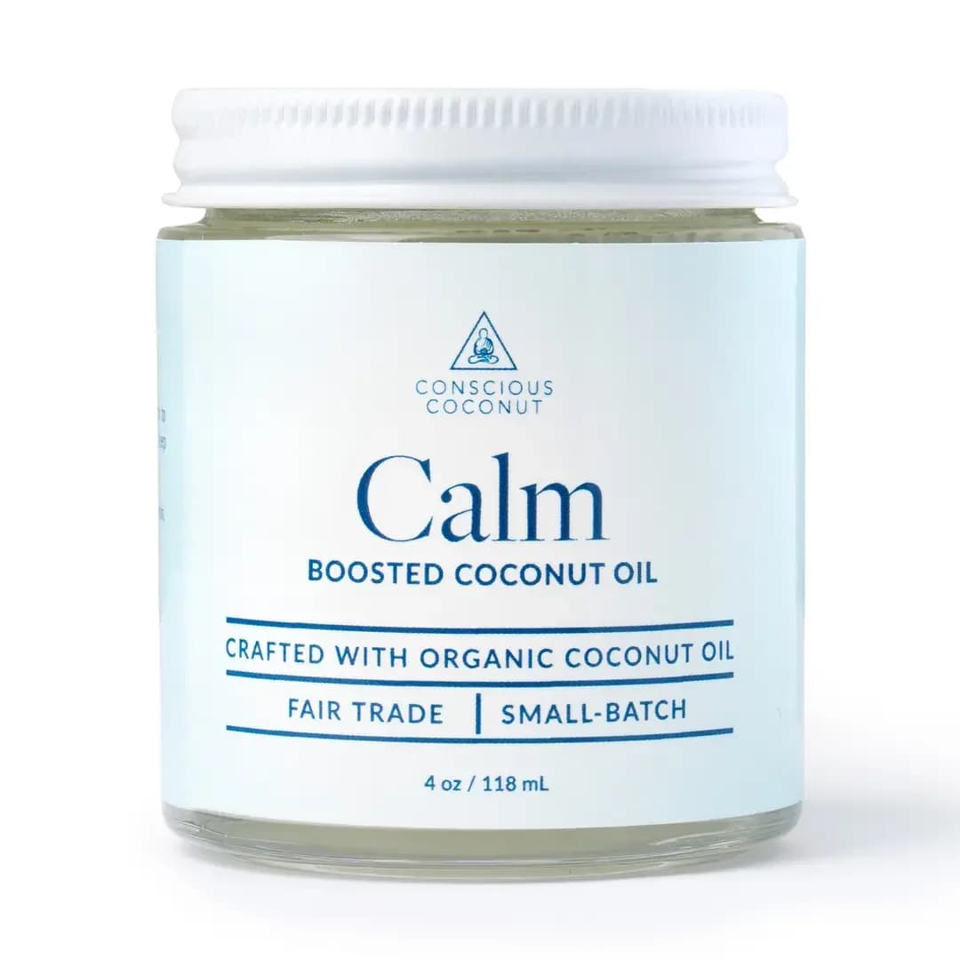 Conscious Coconut Calm Body Oil - A compact jar of Calm coconut body oil that reads like a mini spa moment-soft white and pale blue packaging with clean, calming typography makes this perfect for a housewarming gift, thoughtful care package, or a "thinking of you" treat. The relaxed, wellness-focused look signals gentle, everyday self-care the recipient can reach for whenever they need a pause.  The jar holds a lightly scented coconut oil blend in a simple white-lidded container with a pale blue-and-white label and comes packaged in a tidy box. Small and travel-friendly, it slots easily into a gift set alongside flowers or candles and makes the person you're thinking of feel cared for without fuss.
