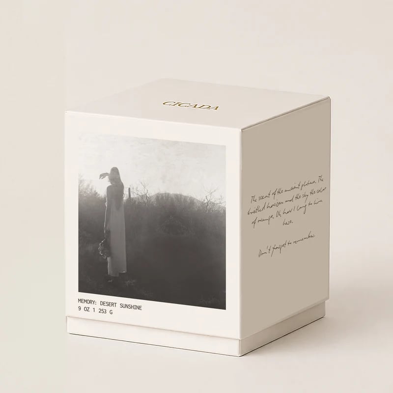 White candle box labeled "Desert Sunshine" with a black-and-white photo