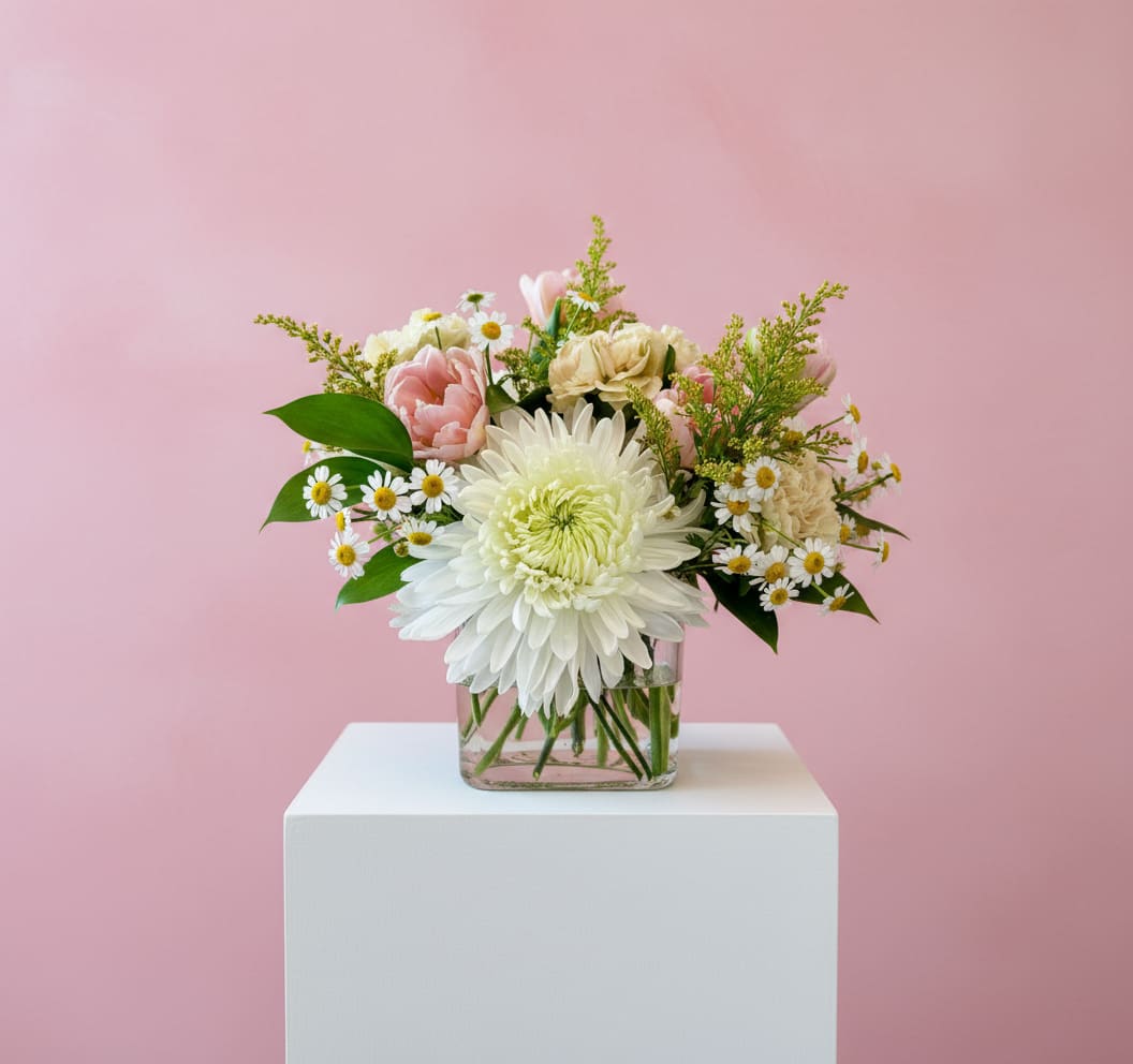 Pink and white mixed bouquet in a clear glass vase