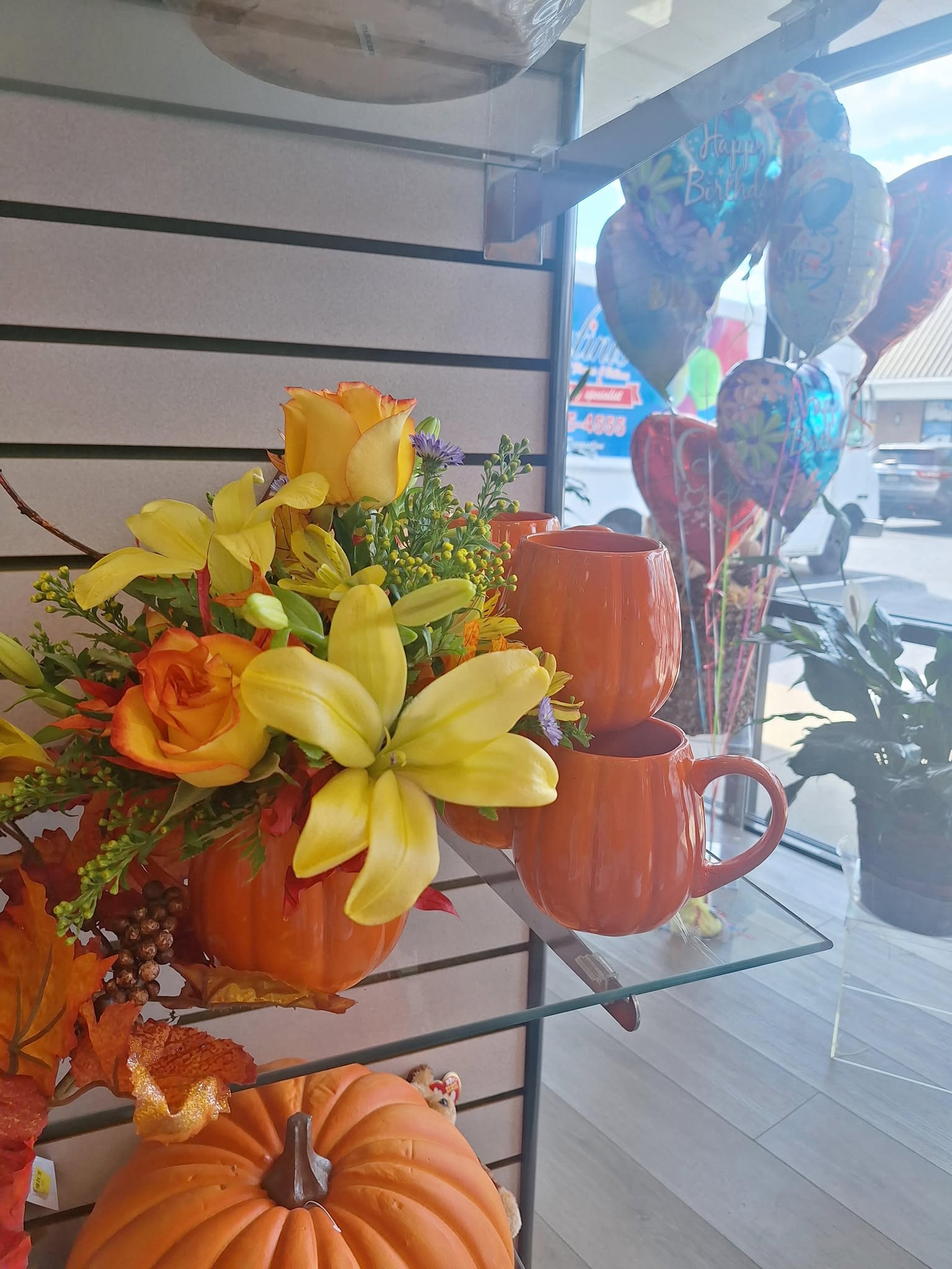 Orange Pumpkin Mug Bouquet - Orange pumpkin mug keepsake floral bouquet add any 18in mylar balloon , stuffed animal, or box of chocolates.