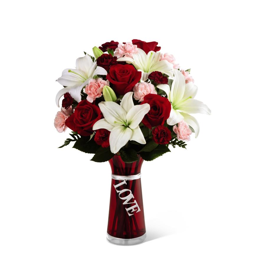 FTD Expressions of Love Bouquet - The FTD Expressions of Love Bouquet brings together roses and Asiatic lilies to represent of all the love and passion in your heart. Rich red roses, white Asiatic lilies, pink mini carnations, burgundy mini carnations and lush greens are arranged to perfection to create a stunning flower bouquet. Presented in a red glass vase accented at the neck with a dangling silver metallic decorative tag stating, Love, this flower arrangement is the perfect way to express your deepest, most romantic feelings.