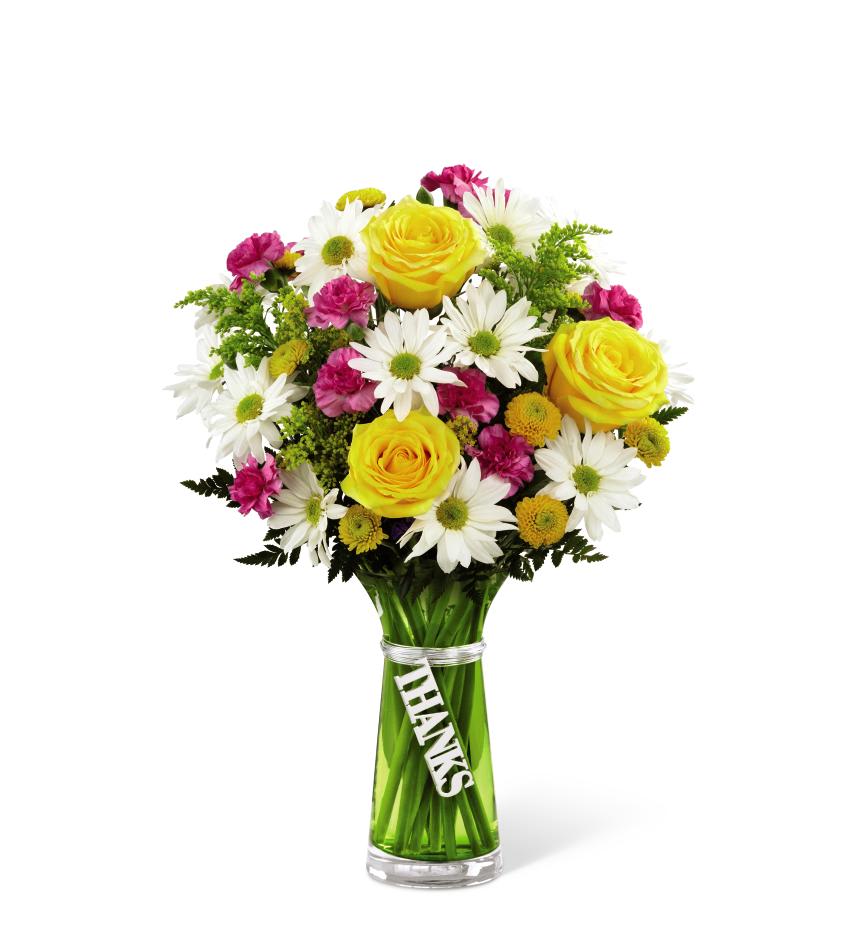 Thanks Bouquet - Thanks Bouquet is a simply gorgeous way to send your gratitude and thanks to friends, family, and loved ones near and far! Bright yellow roses are surrounded by white traditional daisies, hot pink mini carnations, yellow button poms and lush greens to create an impressive flower arrangement. Presented in a designer green glass vase with a silver metallic decorative tag stating, Thanks dangling from the neck, this mixed flower bouquet is a wonderful gift to send as a thank you to any of the deserving people in your life. 