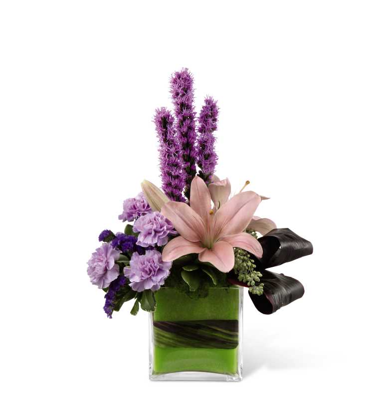  Cosmopolitan Cube Arrangement - Cosmopolitan Cube Arrangement, with Asiatic lilies and carnations, creates an elegant display of floral beauty that makes it an ideal flower bouquet to celebrate any of life's special moments. Pink Asiatic lilies, lavender carnations, purple liatris, purple statice and a variety of lush greens are artfully arranged in a clear glass cubed vase set with lime green foam. Accented with ti leaves tied in an eye-catching fashion around the vase, this bouquet creates a beautiful way to convey your happiest wishes. GOOD bouquet includes 10 stems. BETTER bouquet includes 13 stems.  BEST bouquet includes 19 stems. 