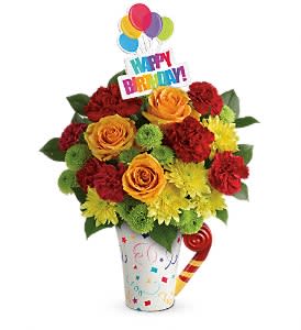 Birthday bouquet in a decorated cup with a Happy Birthday topper and balloons
