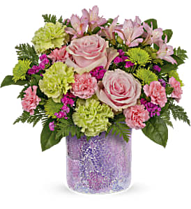 Pink roses and carnations in a purple vase