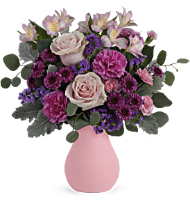 Pink and purple mixed bouquet in a pink vase