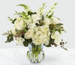 White floral bouquet in a clear glass vase