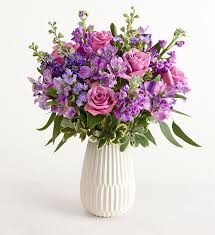 Lavender Expressions - This white teardrop grooved vase is eye pleasing without taking away from the beautiful array of purple shades of flowers
