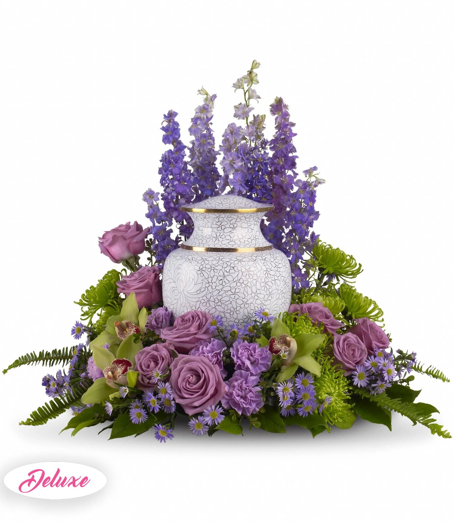 Purple floral arrangement around a white urn vase