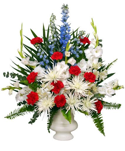 PATRIOTIC MEMORIAL - A funeral arrangement with red, white, and blue blooms in a vase (Different colors/flowers may be possible based on availability. Please call to make sure we have the colors and flowers you are looking for, thank you!)
