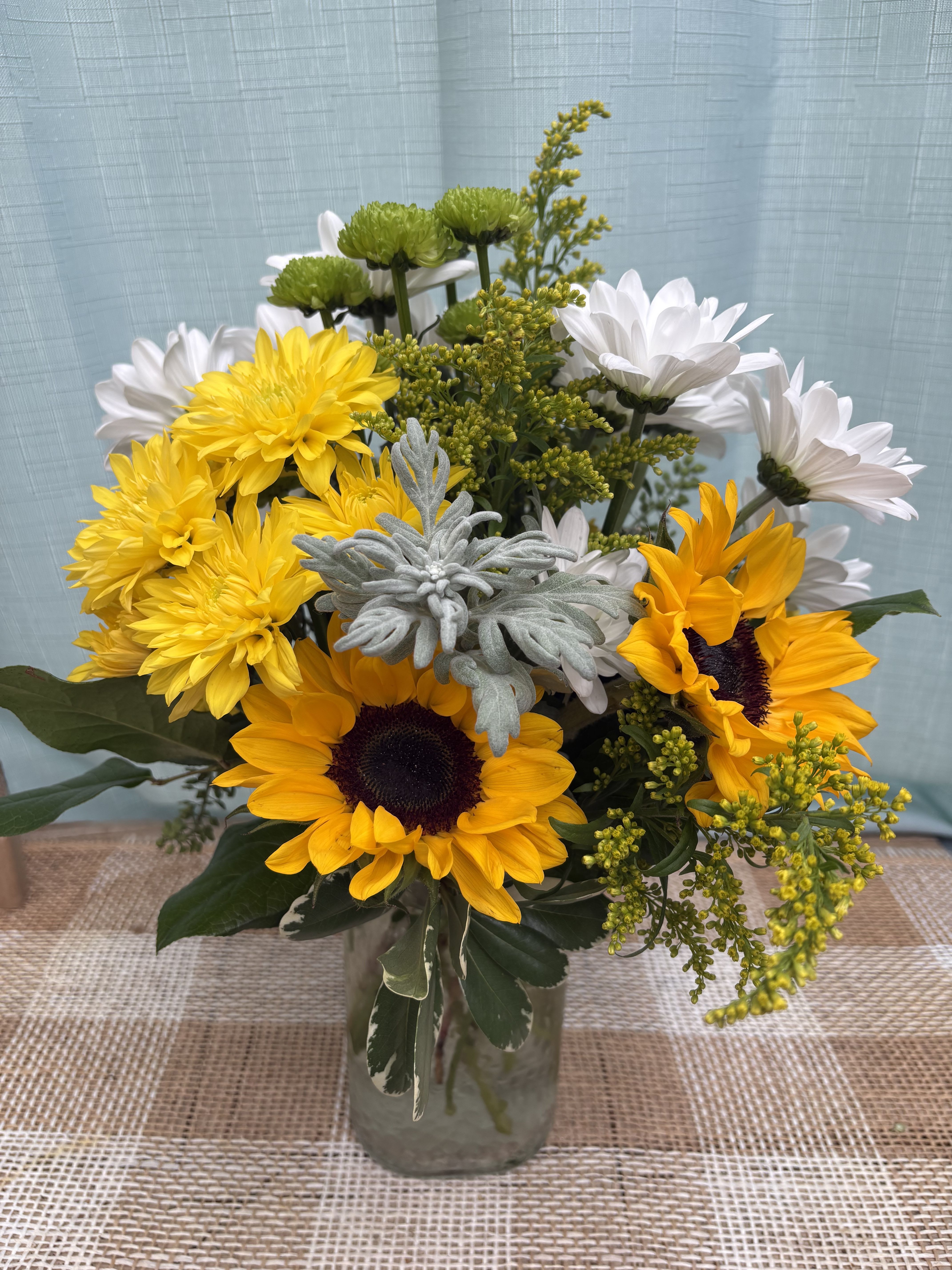 DAYS OF SUNSHINE - A bright fresh arrangement, perfect for evoking the feeling of sunny weather and blue skies