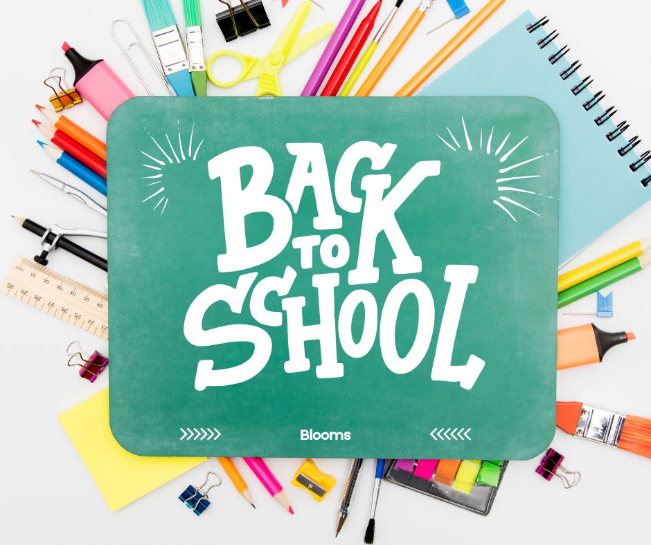 Back to school sign surrounded by colorful school supplies