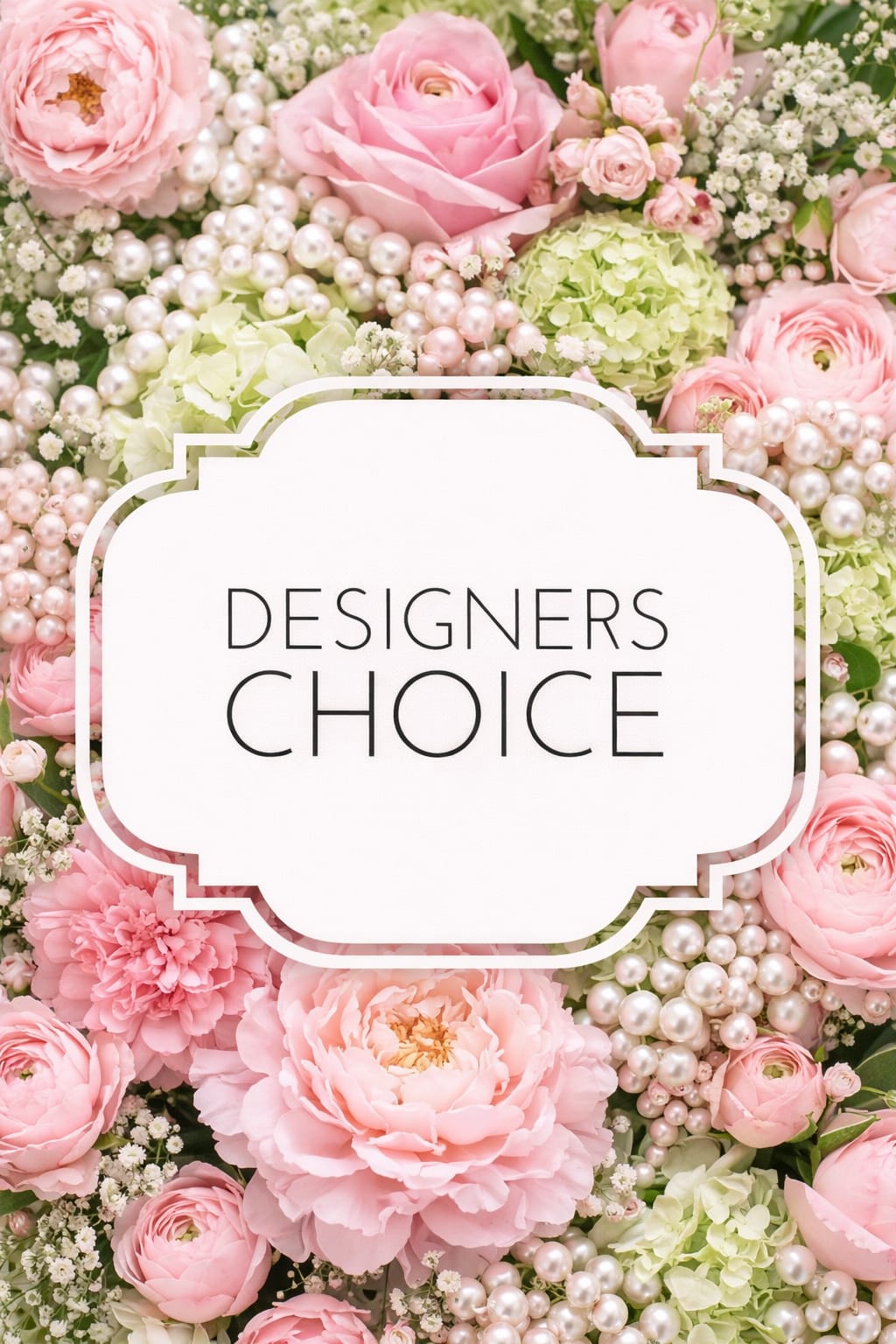 Pink and green floral arrangement with pearl accents and a "Designers Choice" sign