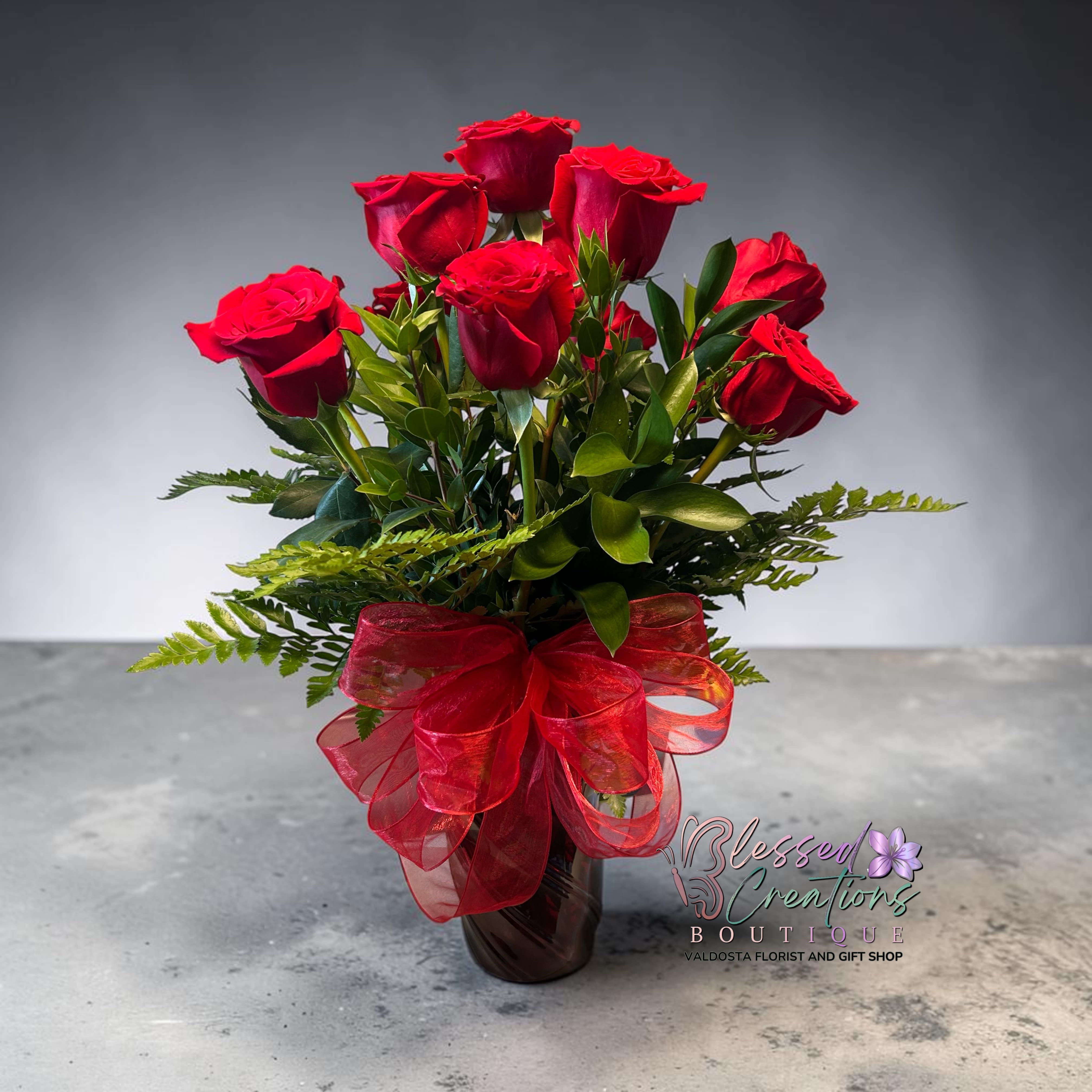 Dozen Long Stemmed Red Roses - These dozen red roses are the classic romantic gift! Perfect for Valentine's Day or Anniversary or Just Because in red vase. 