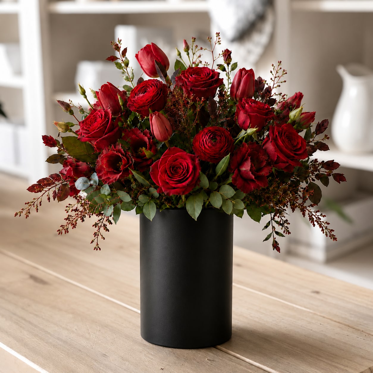 Red rose bouquet in a black vase