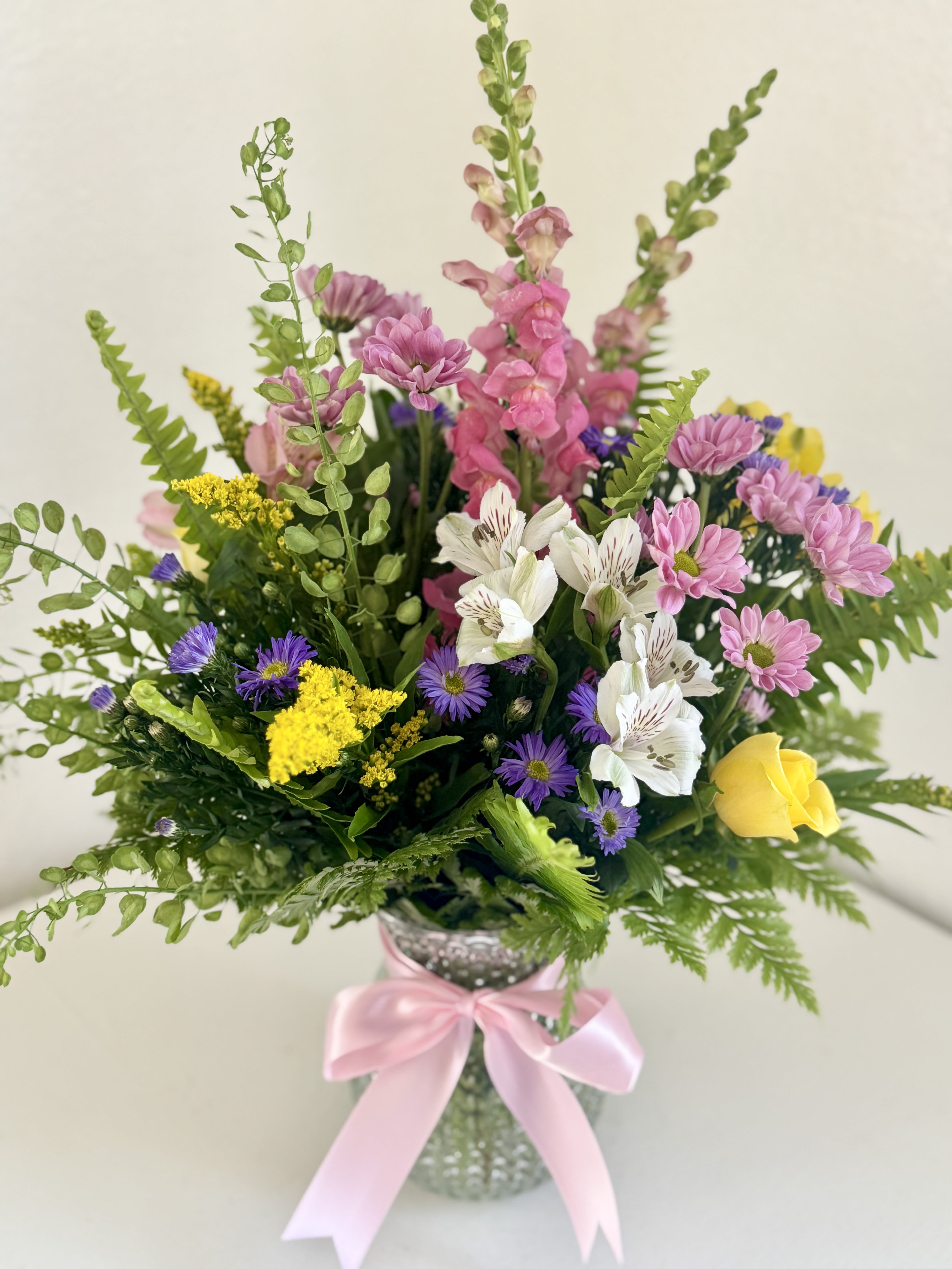 Mother's Meadow - Like a gentle walk through a blooming spring meadow, this arrangement is bursting with love and color. A perfect way to say "Thank You" to the heart of the family.